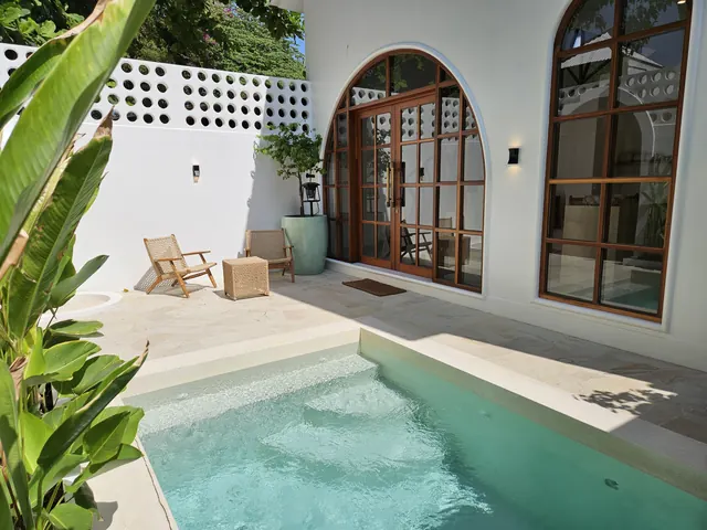 Private villa courtyard and rooms beside the pool