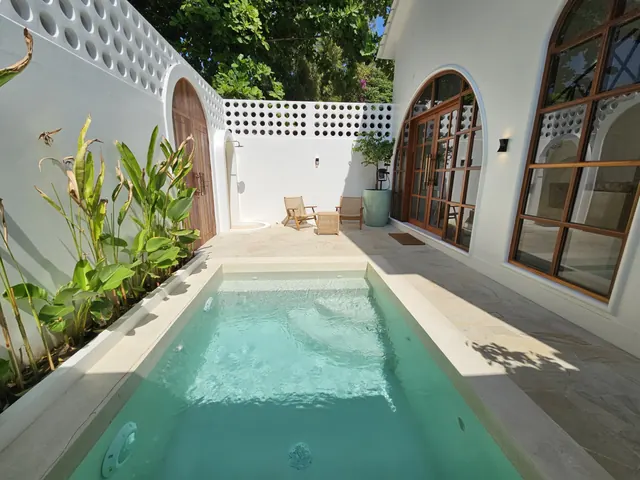 Private villa pool and courtyard in daylight